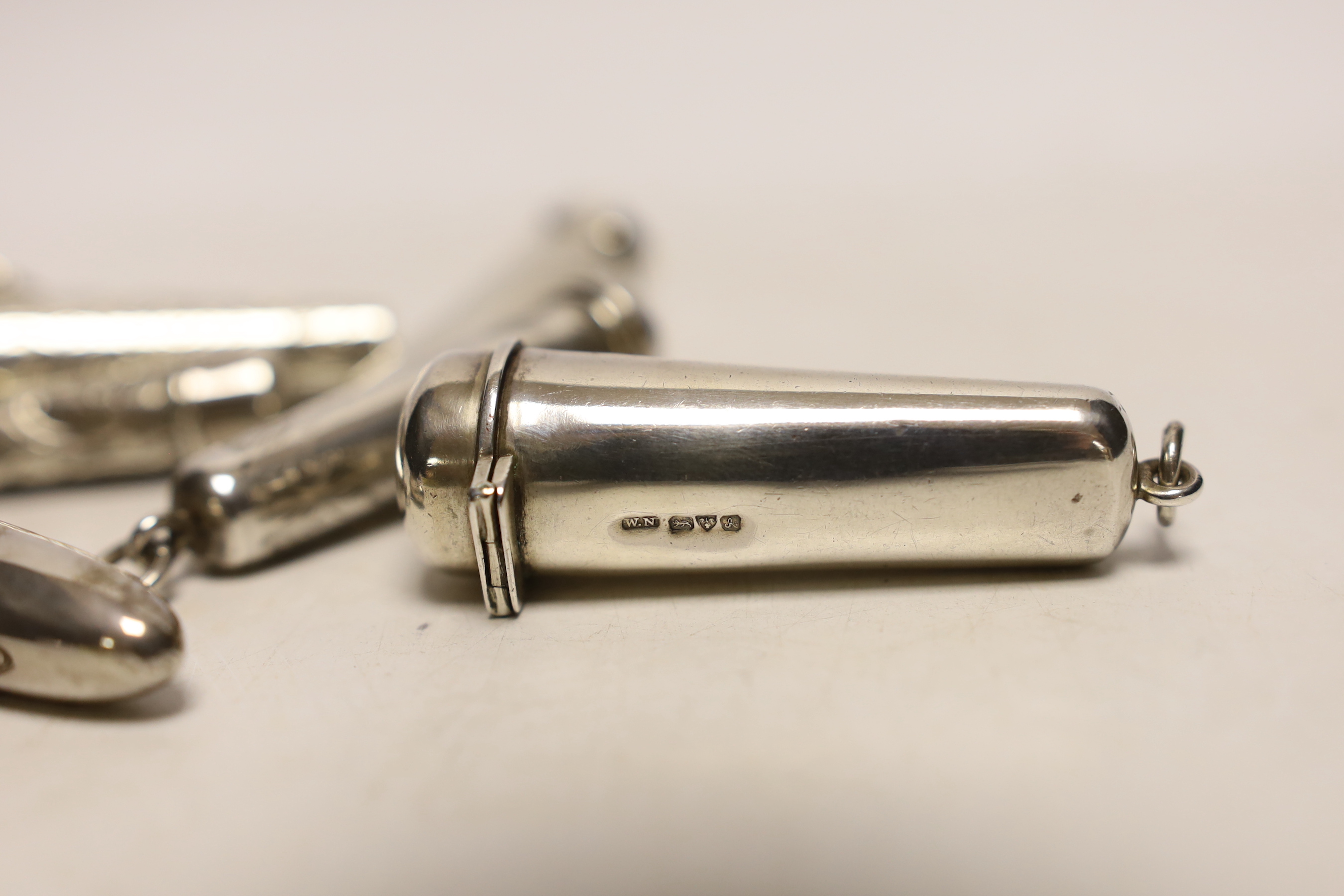 Six assorted mainly early 20th century silver cigar or cigarette holder cases, including two containing 9ct gold mounted amber holders, largest 75mm.